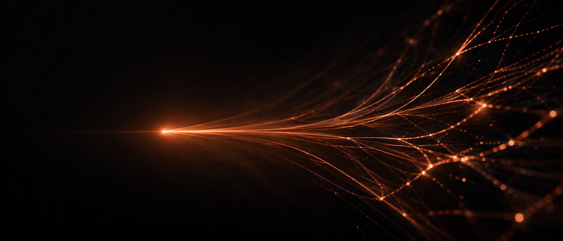 A point of warm light fanning into many fine threads